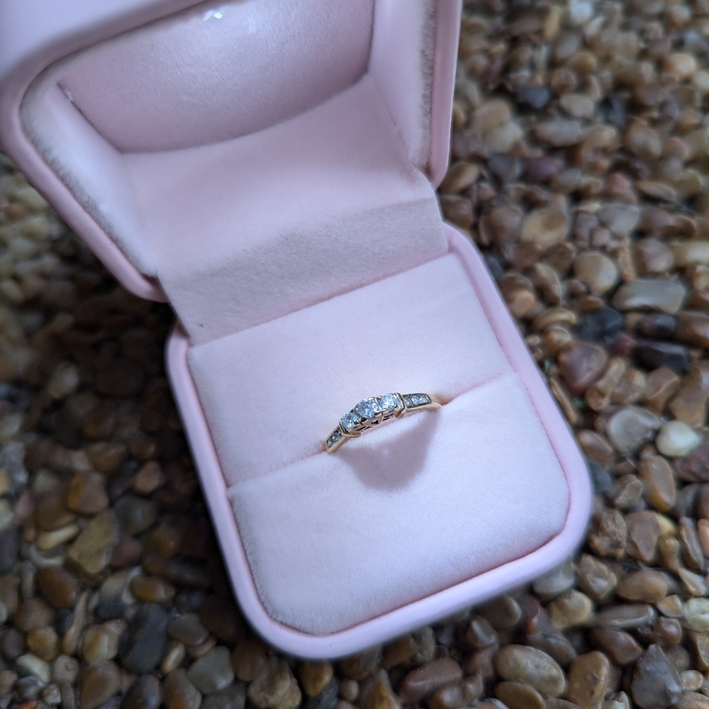 Three Stones promise 10k  gold diamond ring, diamonds on the side size 5.25